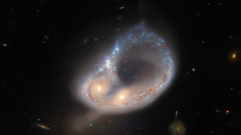 A close-up image of the galaxy merger Arp-Madore 417-391 that was recently taken by the Hubble space telescope. A near-perfect ring of stars has been created by the gravitational forces of the massive cosmic collision.